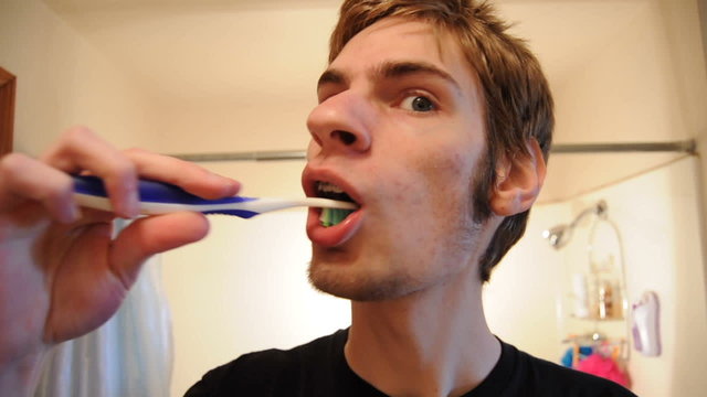 Teenager Brushing Teeth