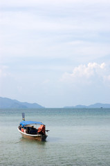 Fototapeta premium boat in a peaceful sea