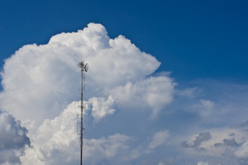 Radio mast on blue sky background.