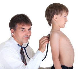 Doctor examining boy