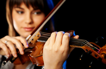 blurred female violinist