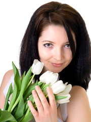 Obraz na płótnie Canvas Attractive woman with white tulips
