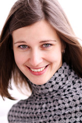 Portrait of young happy smiling woman, isolated on white