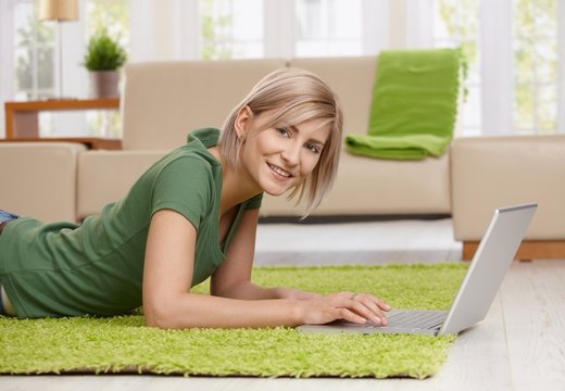 Woman surfing the internet at home