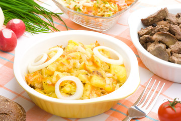 Served bowl of braised potatoes