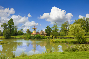 Fototapeta na wymiar Marlborough Tower and pond of Versailles Chateau. Francja