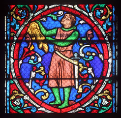 Fototapeta na wymiar Stained glass window in Cathedral Notre Dame de Paris