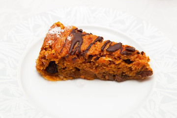 Piece of carrot cake on white plate