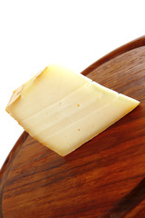 light edam cheese on wood