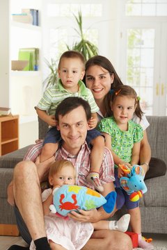Portrait of happy family with three children