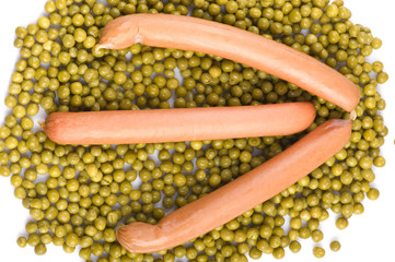 green peas with frankfurter on white