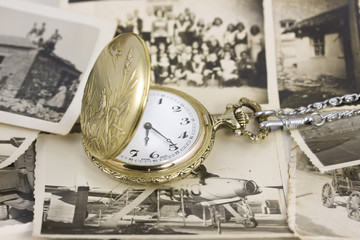 vintage pocket watch with b&w photo background