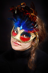 Young woman in carnival mask