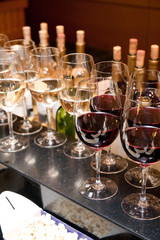 glass drink red wine on buffet outdoor party in row