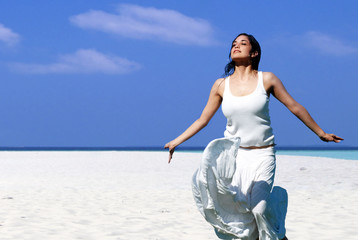 Happy woman on the beach