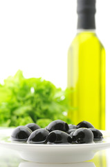 Black olives, greens and oil