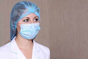 Closeup portrait of a young doctor wearing a mask