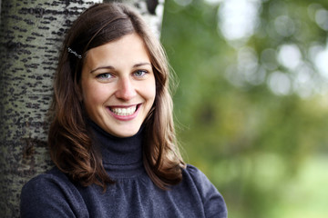 Closeup portrait of a happy young woman smiling