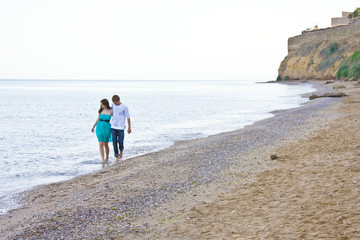 couple enjoying themselves on the beach