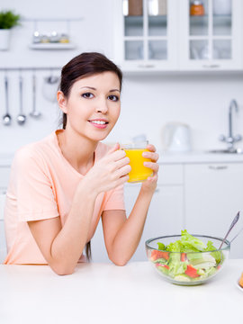 Woman with fresh orange juice