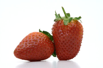 A pair of strawberries on a white background