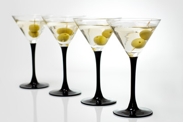 Martini with olives on a white background