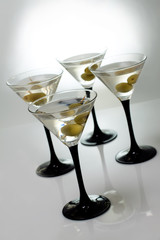 Martini with olives on a white background
