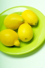 lemons on green plate