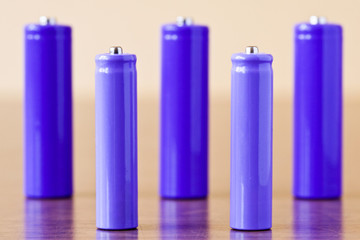 group of a purple  alkaline batteries on the table