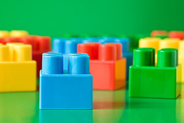 colorful childish  blocks on green background