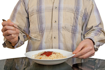 Human hands with fork and spaghetti