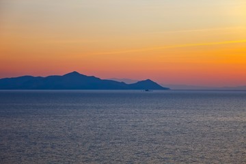 Naklejka na ściany i meble Islands in Aegean sea at sunrise