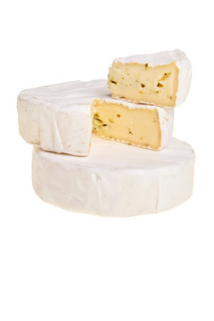 Stacked camembert cheese over white background.