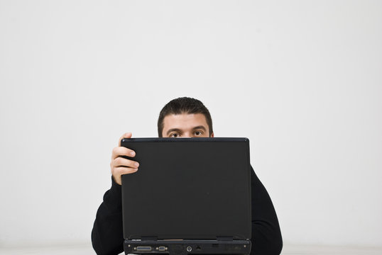 Hacker Man Behind Laptop