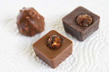 Several chocolate candies on white