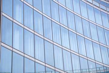 Fototapeta na wymiar Modern building glass reflections
