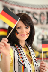 Jeune femme supportrice de l'Allemagne - obrazy, fototapety, plakaty