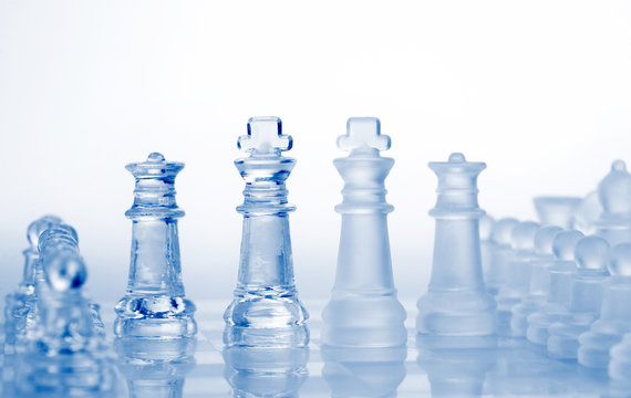 glass chess pieces with blue light
