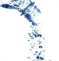 bottle in pure water with waves and bubbles