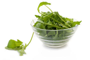 arugula in glass bowl