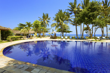 Pool, ocean, palm trees. .Indonesia. Bali..