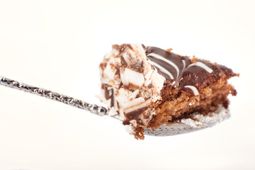 spoon with chocolate cake