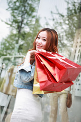 asian girl with shopping bags