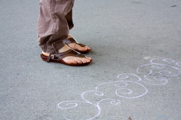 Legs, feet, shoes and drawing.