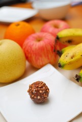 Contrast of fruits and unhealthy sweets