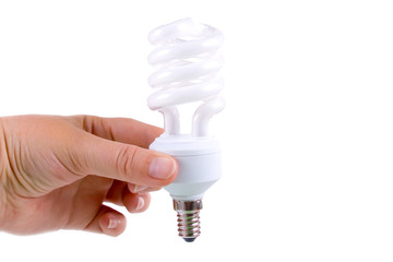 Energy-saving lamp in a hand