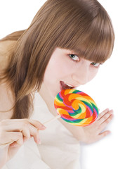 Bright picture of happy blonde with color lollipop