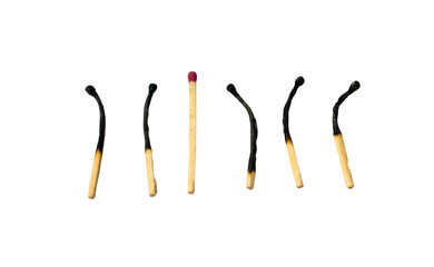 One healthy and 5 burnt matches in row. Isolated on white.