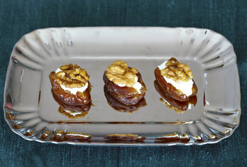 Dates filled with ricotta cheese and walnuts