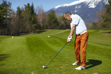 Man golfer preparing for a swing